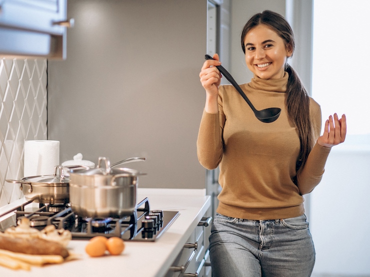 Woman cooking at kitchen
